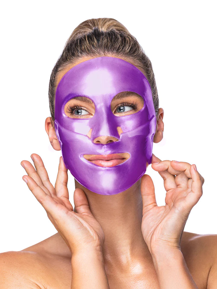 Woman wearing a purple facial mask on a white background